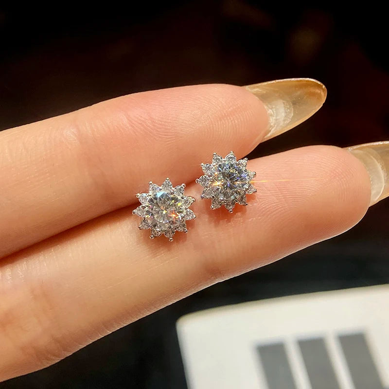 Sunflower Halo Moissanite Stud Earrings - pair held for scale