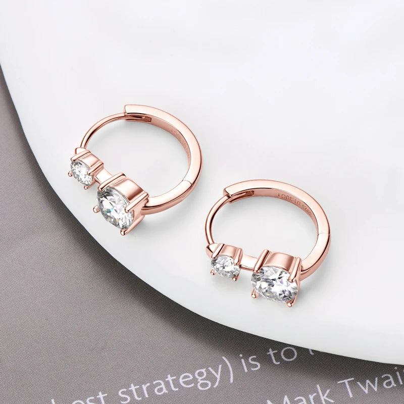 Graduated Two-Stone Moissanite Hoop Earrings in Sterling Silver — Rose Gold-Tone pair laid flat