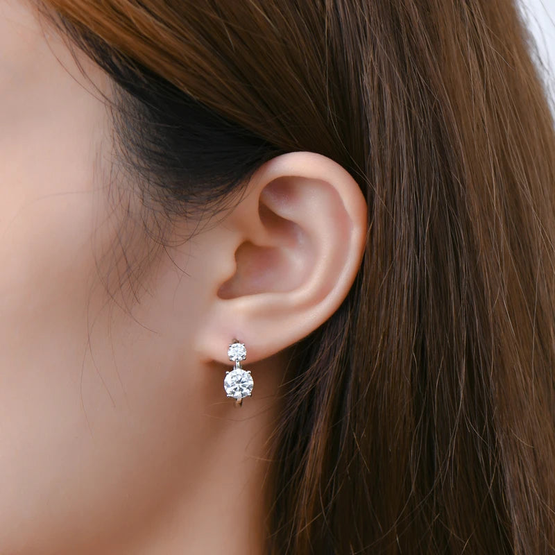 Graduated Two-Stone Moissanite Hoop Earrings in Sterling Silver — Two-stone hoops worn on the ear