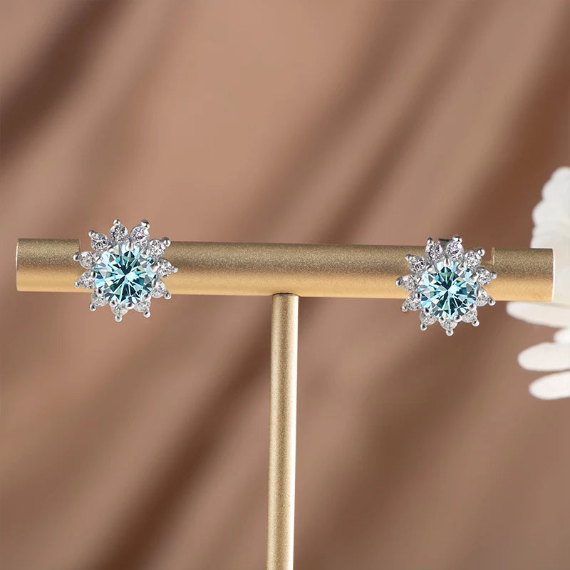 Colored Sunflower Halo Moissanite Stud Earrings in Silver — Blue pair on stand