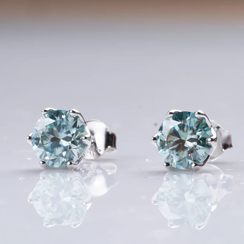 Round Moissanite Stud Earrings in Platinum-Plated Silver - Pale blue studs close-up