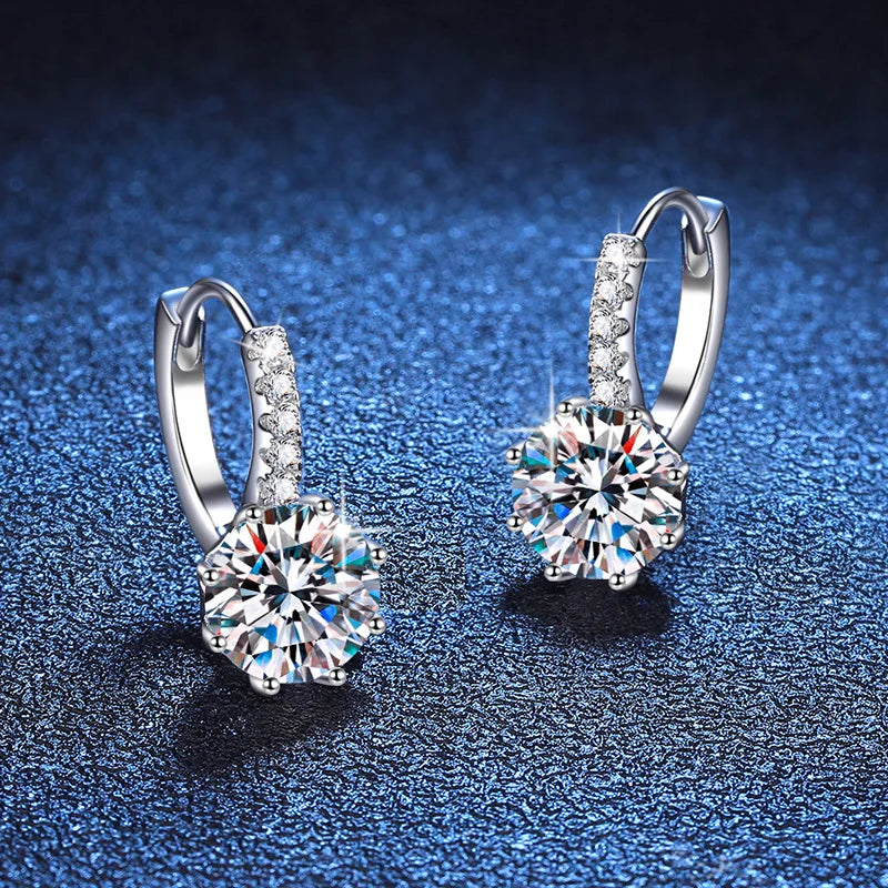 Colored Round Moissanite Leverback Earrings in Silver — White pair on blue surface