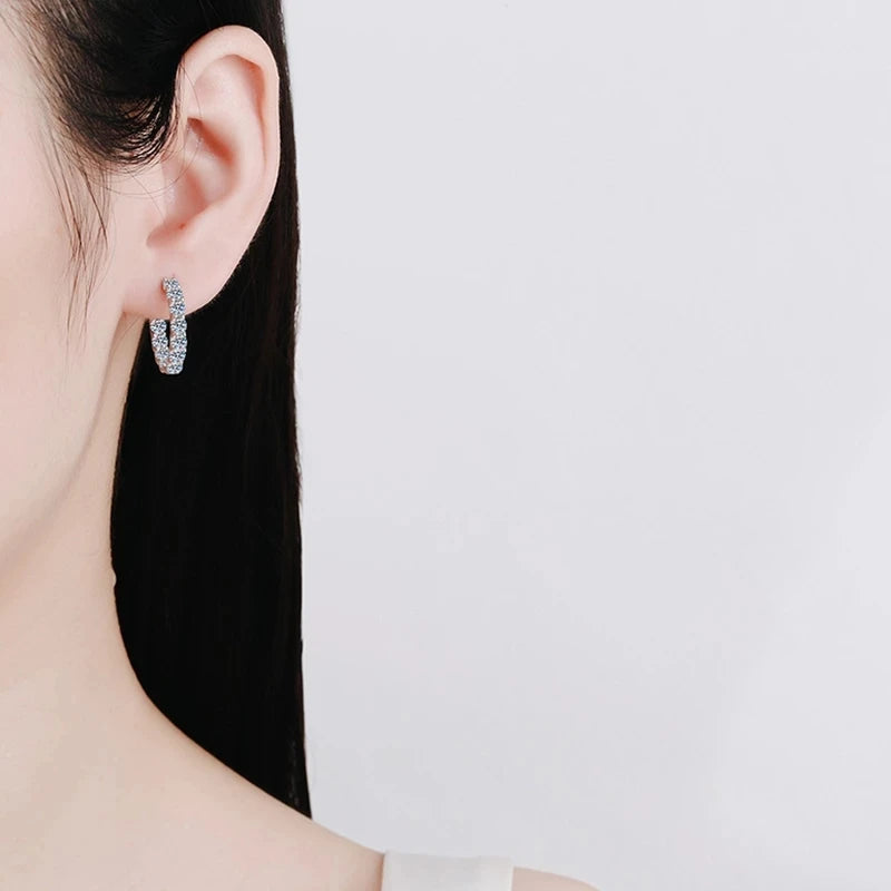 Round Moissanite Hoop Earrings in Plated Sterling Silver — Worn on ear