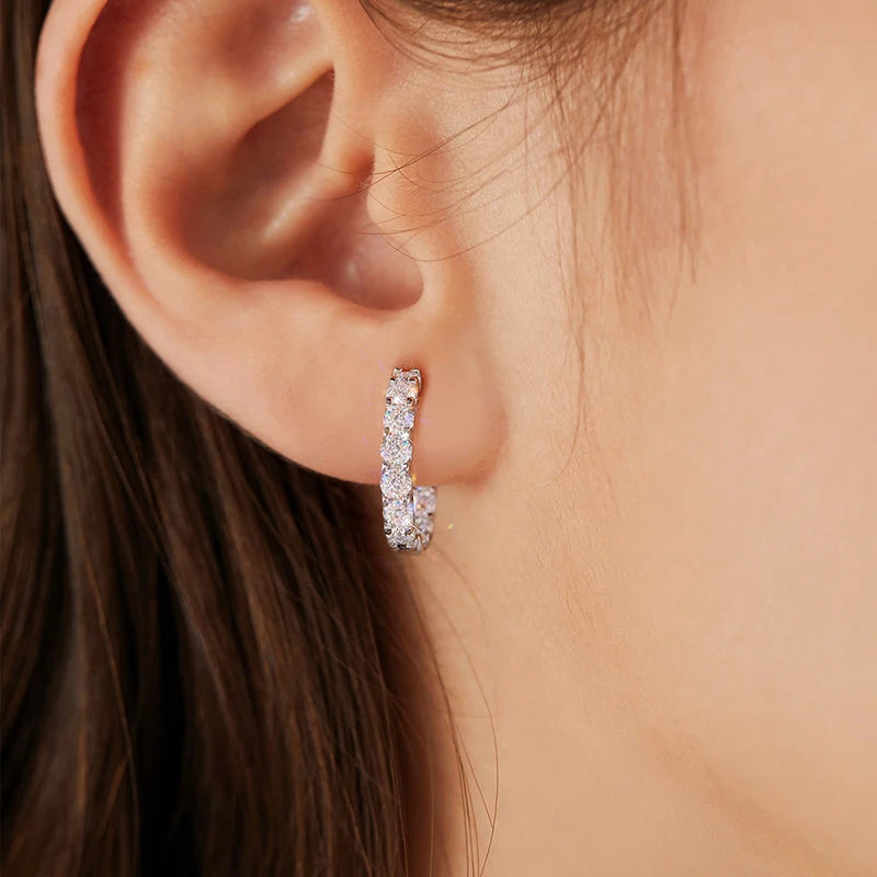 Round Moissanite Hoop Earrings in White Gold-Plated Silver — Worn on ear