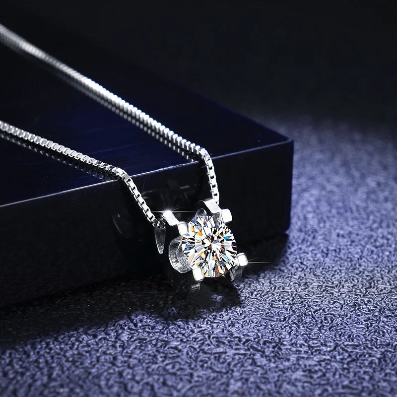 Colored Moissanite Necklace & Stud Earring Set in Silver — White pendant on dark surface