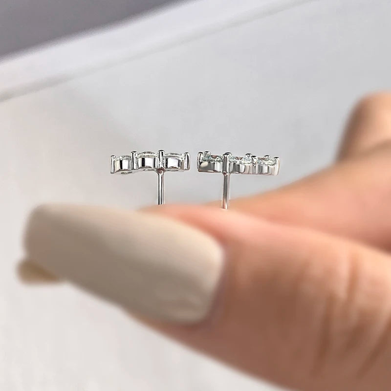 Three-Stone Moissanite Curved Stud Earrings in Sterling Silver — Post detail