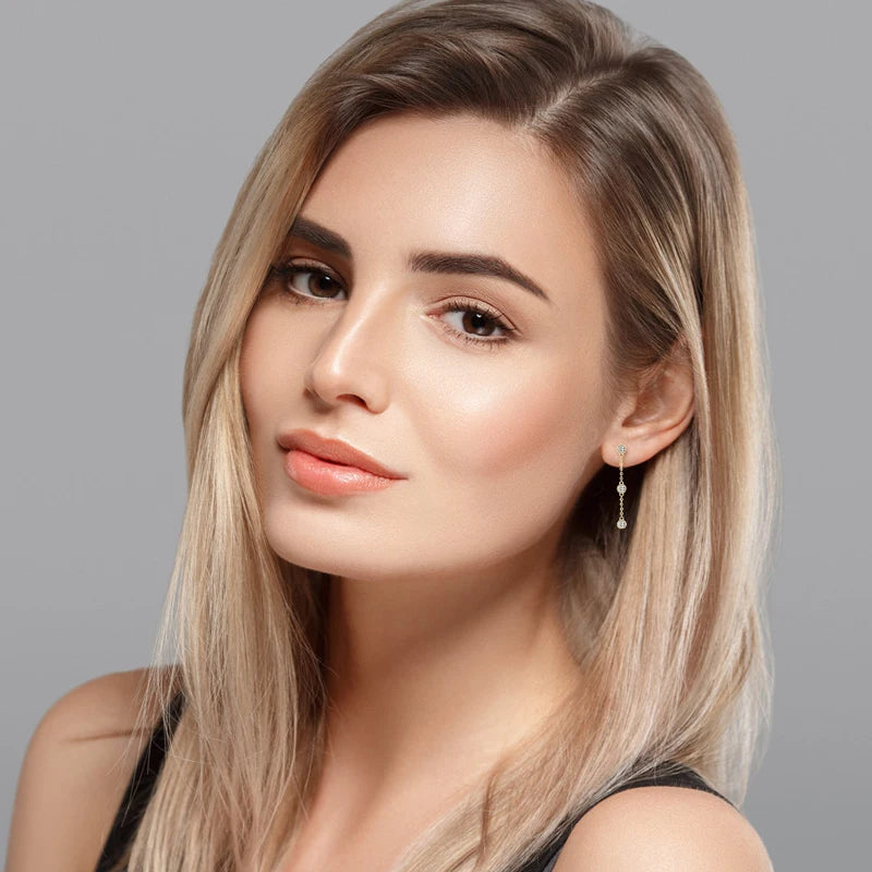 Three-Stone Bezel Moissanite Chain Drop Earrings in Silver — Shown on ear