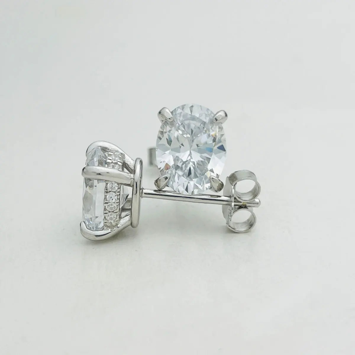 Oval Moissanite Stud Earrings in Sterling Silver — Basket and posts