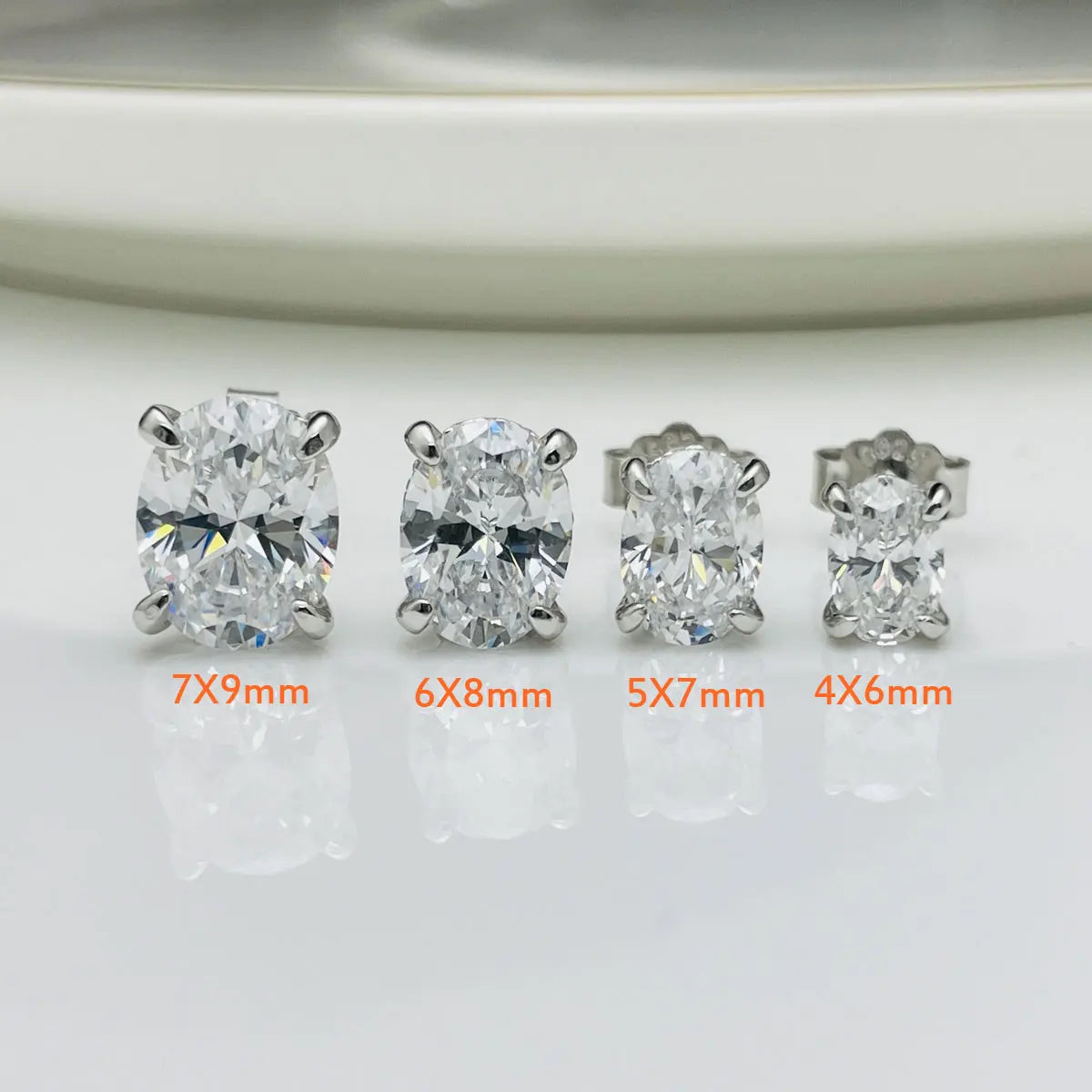 Oval Moissanite Stud Earrings in Sterling Silver — Oval size comparison