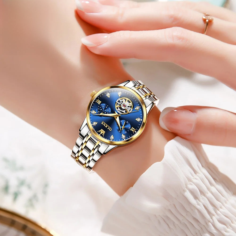 Women's Open-Heart Automatic Bracelet Watch — Blue open-heart watch held in hand — BandsCo Straps