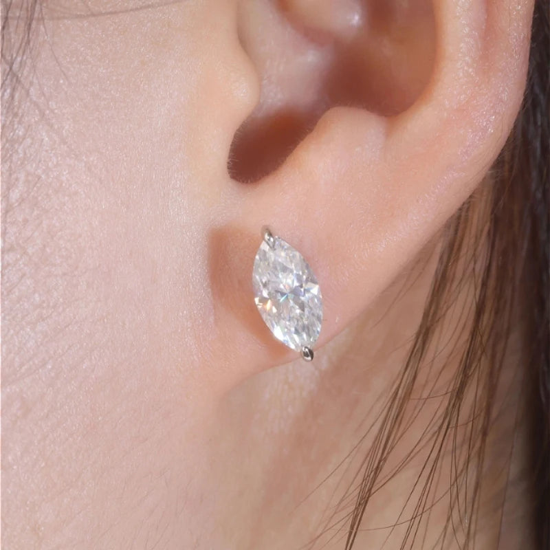 Marquise Moissanite Stud Earrings in 925 Sterling Silver — Shown on ear