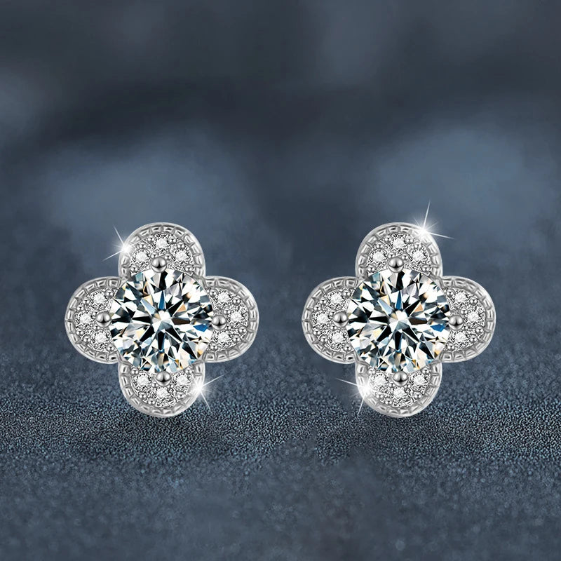 Clover Moissanite Stud Earrings with Zircon Accents in Silver — Pair on dark surface
