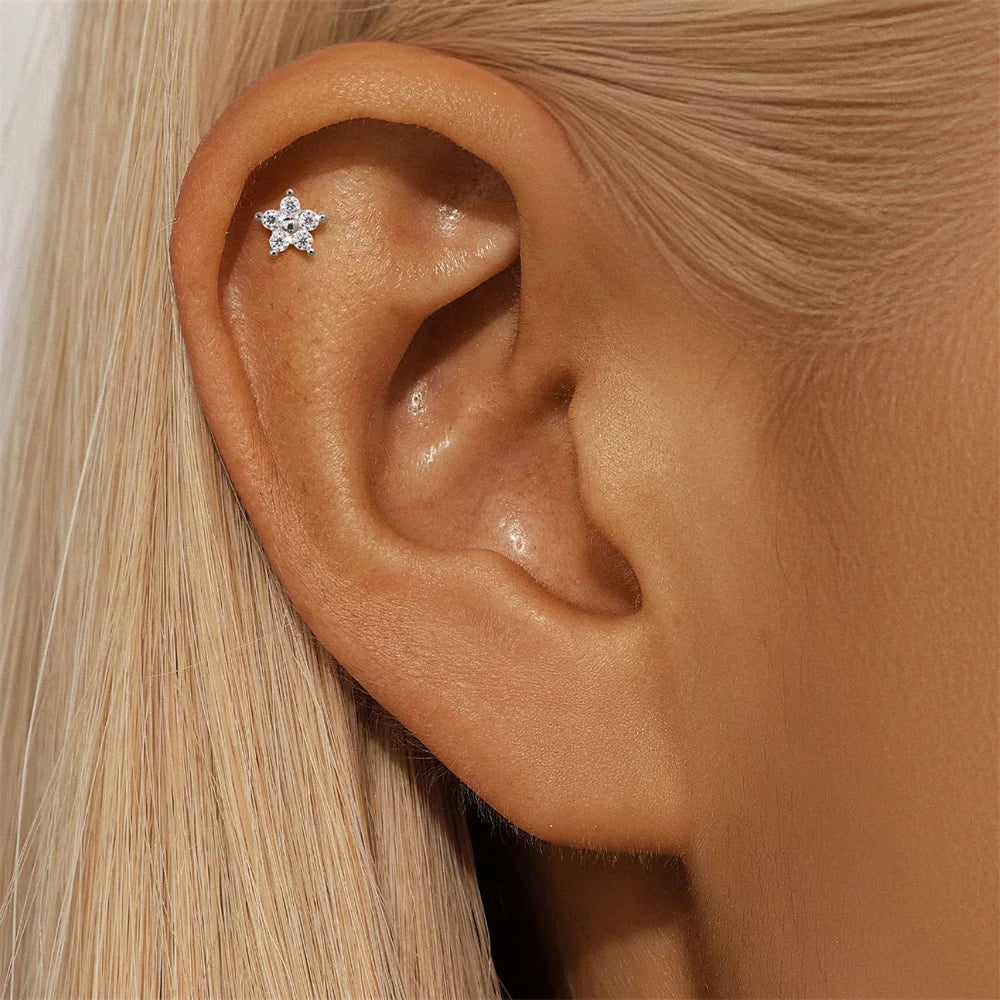 Single Moissanite Earring: Mini Stud & Hoop Styles - flower stud worn
