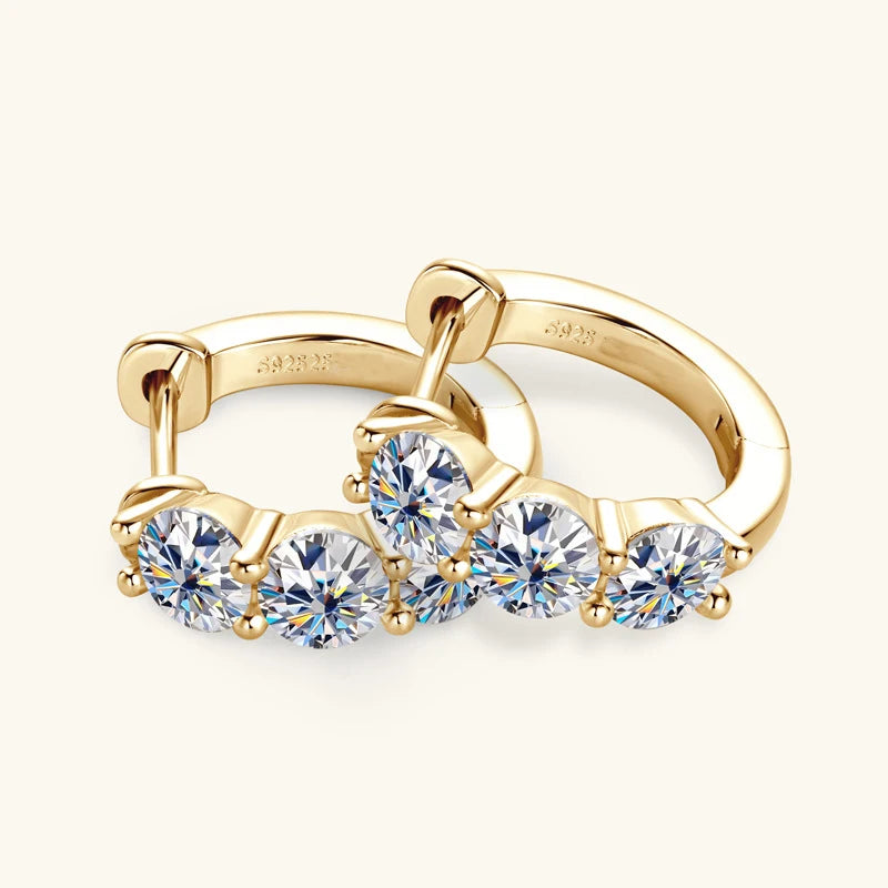 Three-Stone Moissanite Hoop Earrings in Sterling Silver — Gold-tone angled pair