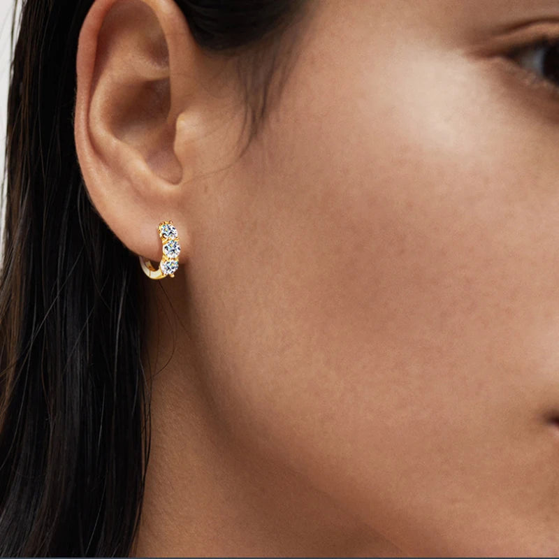 Three-Stone Moissanite Hoop Earrings in Sterling Silver — Shown on ear