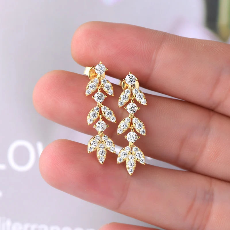 Moissanite Leaf Drop Earrings with Zircon Accents in Silver — Gold-tone pair on hand