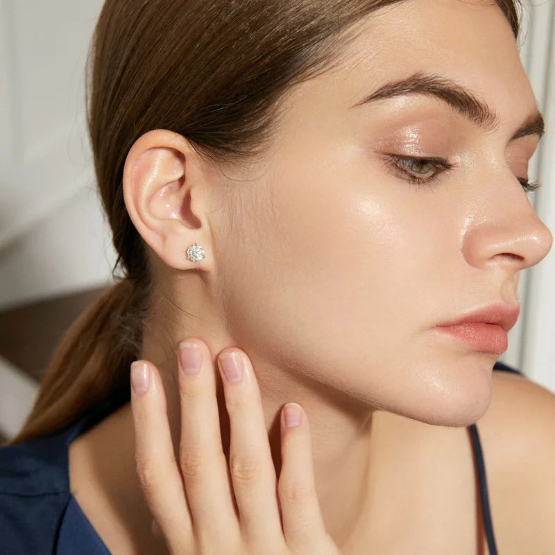 Colored Three-Prong Moissanite Stud Earrings in Sterling Silver — Shown on ear