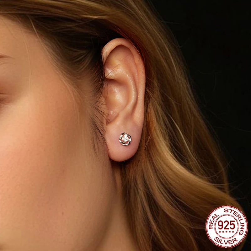 Moissanite Clover Knot Stud Earrings in Sterling Silver — Clover knot worn on ear — BandsCo Straps
