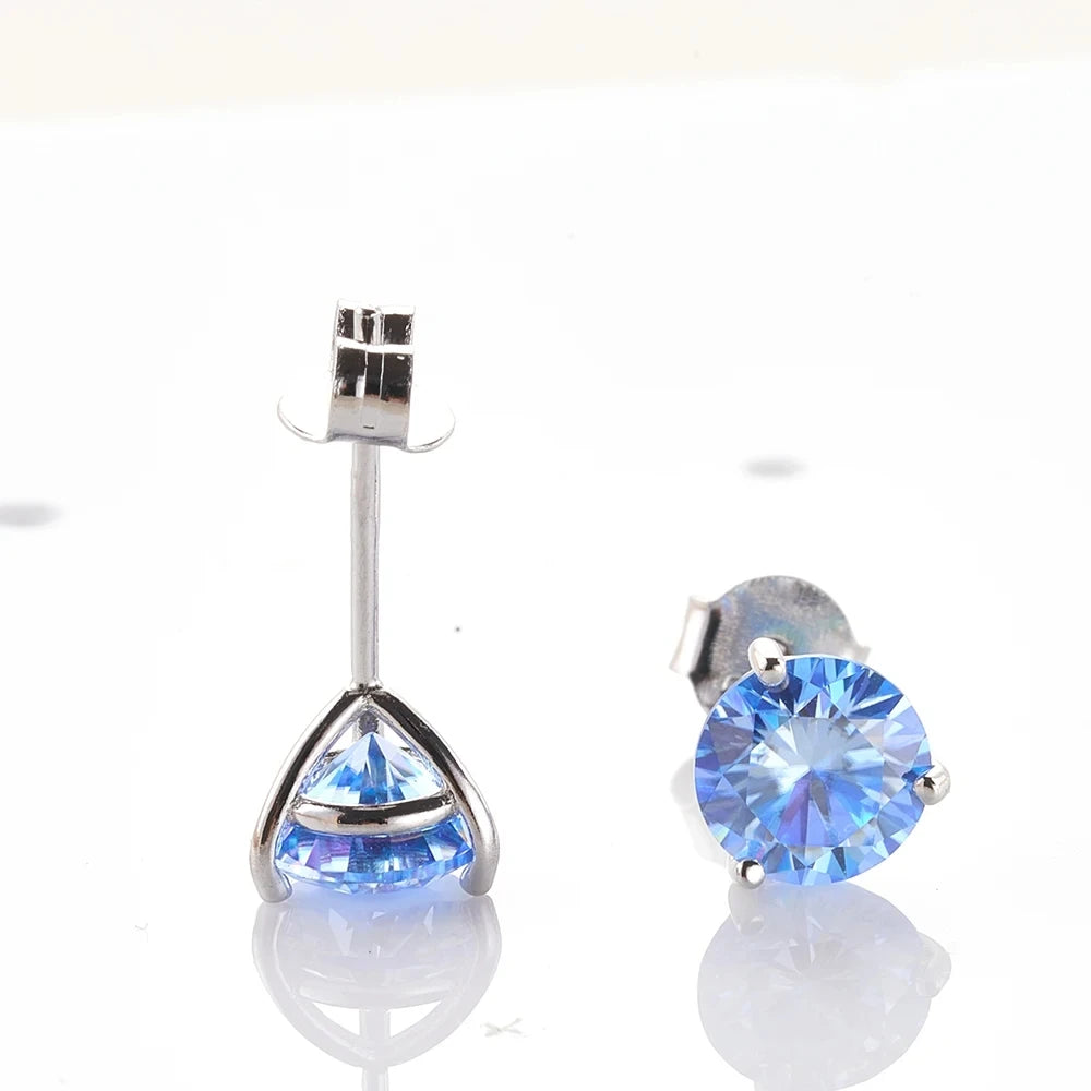 Colored Three-Prong Moissanite Stud Earrings in Sterling Silver — Blue stud detail