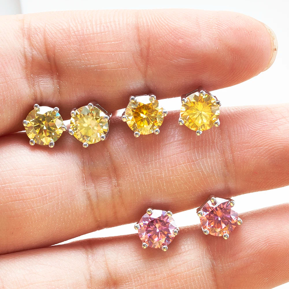 Colored Six-Prong Moissanite Stud Earrings in Sterling Silver — Color comparison on hand