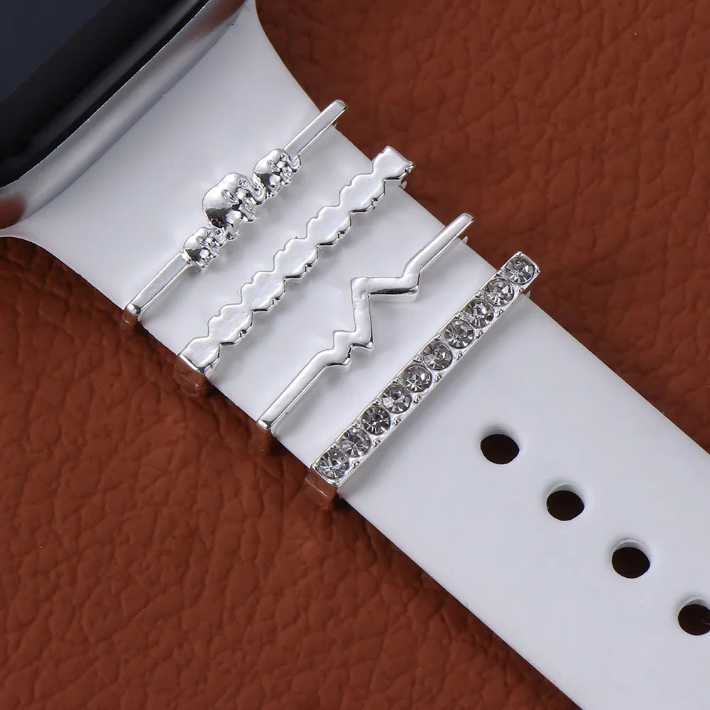 Decorative metal charms on an Apple Watch band, adding elegance and style to smartwatch accessories.