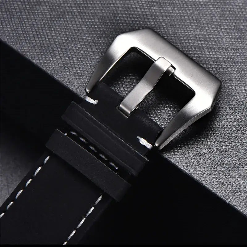 Broad silver-tone buckle and keeper close-up