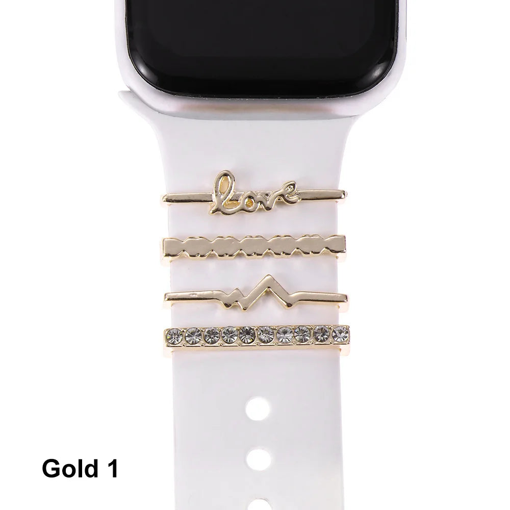 Decorative gold metal charms for Apple Watch bands, featuring stylish designs like 'love' and sparkling accents.