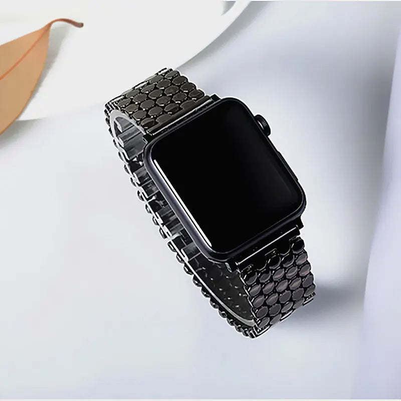 Black fish scale bracelet worn on wrist