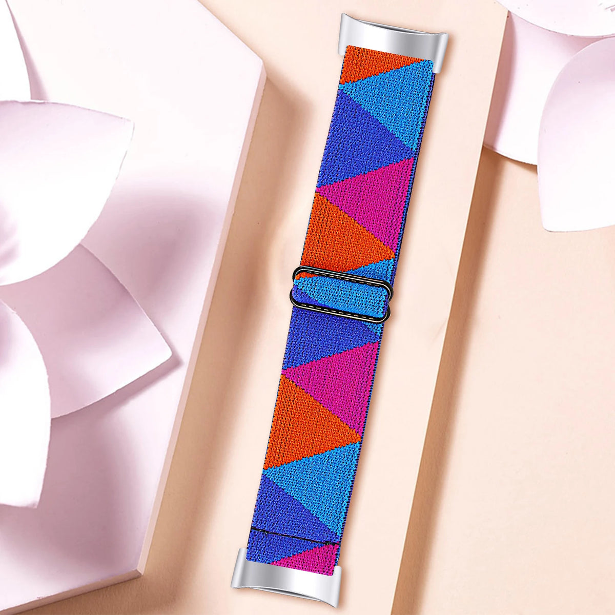 Fitbit Charge 5/6 Adjustable Stretch Nylon Band - Pink, orange and blue geometric strap on wrist