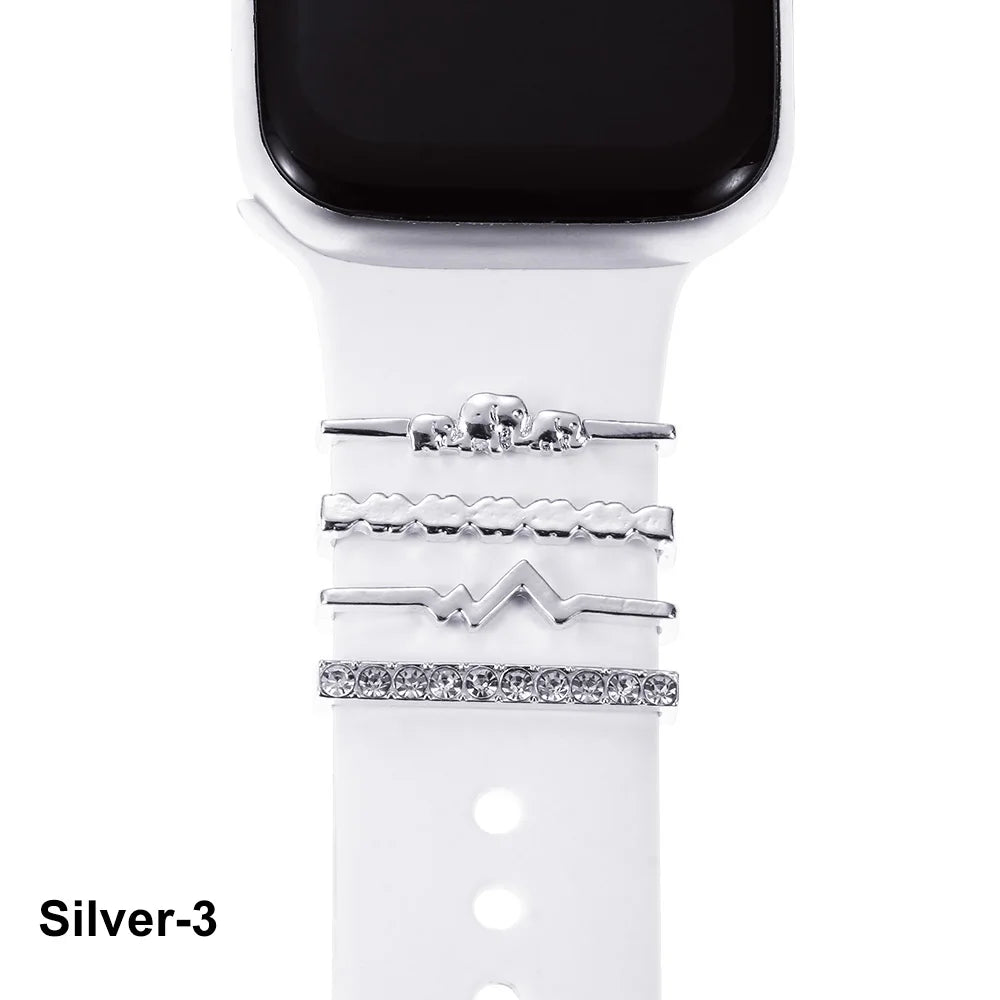 Stylish silver decorative metal charms for Apple Watch bands on a white strap, enhancing elegance and personality.