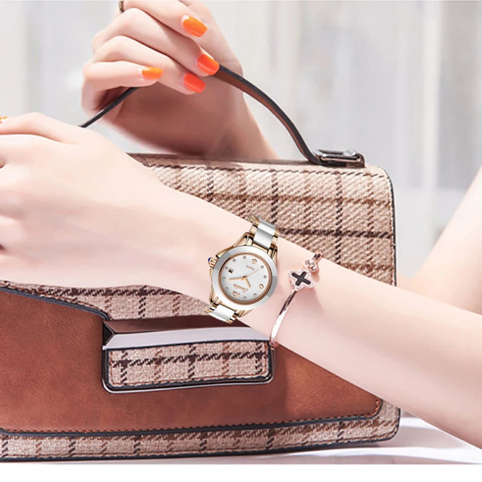 Women's Ceramic and Stainless Steel Date Watch — White ceramic watch worn on wrist