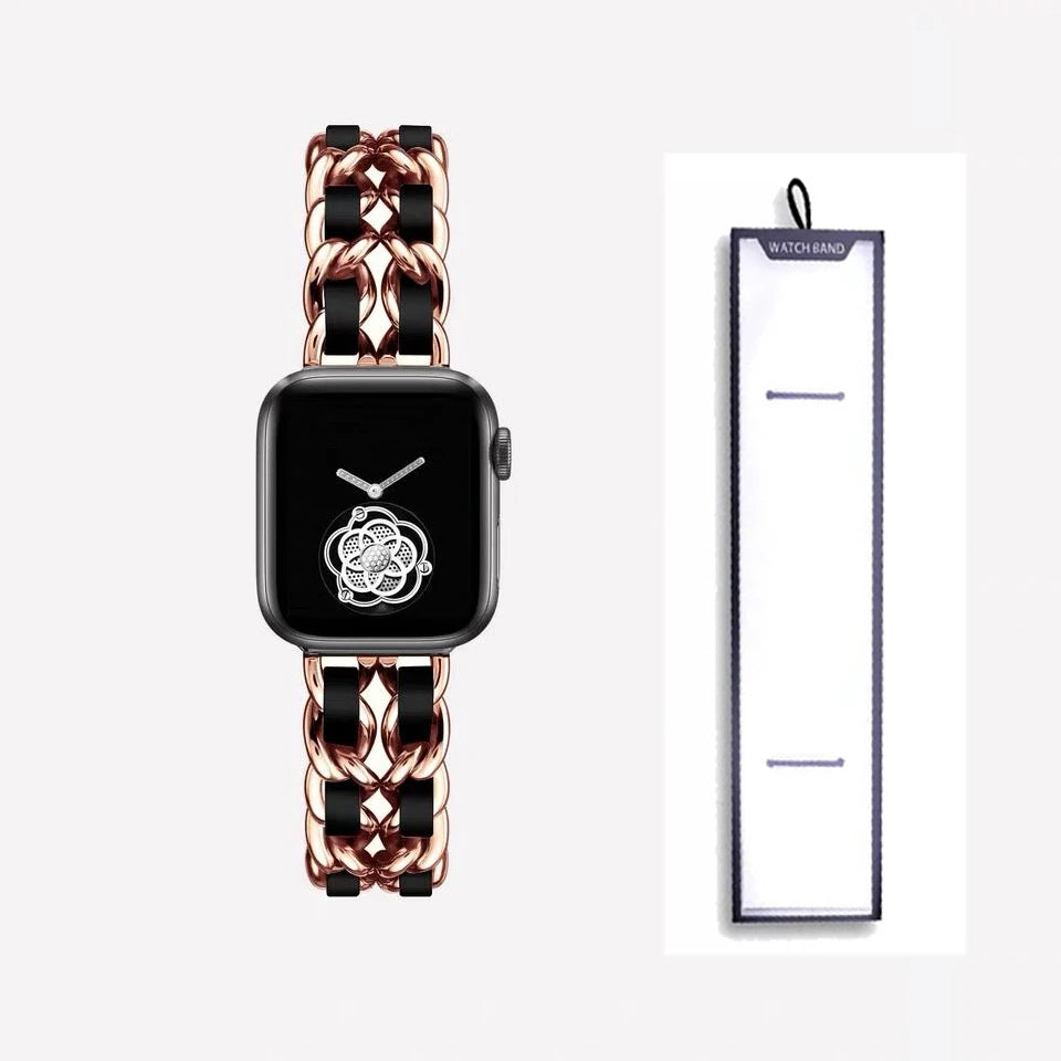 Rose gold chain bracelet with black accents, shown beside packaging for Apple Watch