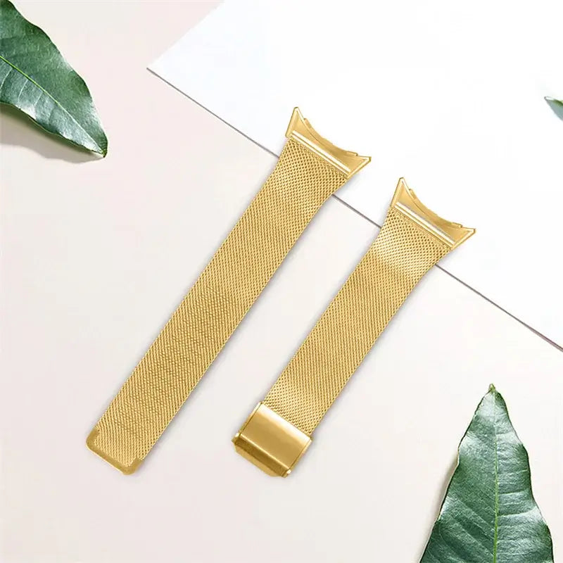 Gold mesh Pixel Watch strap laid flat