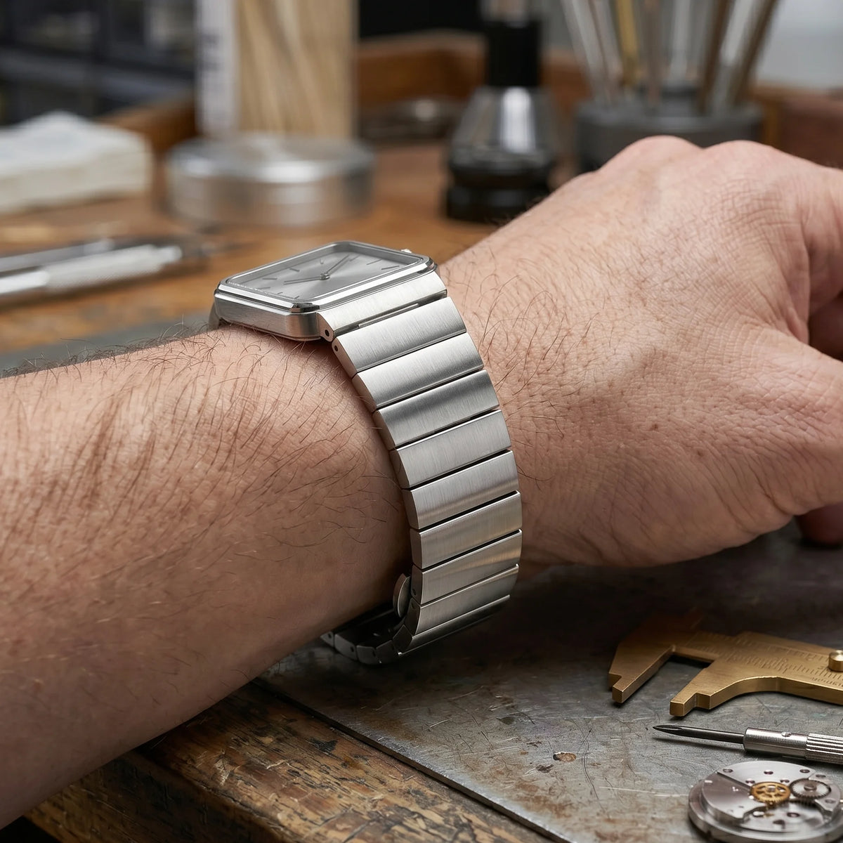 Garmin Brushed Stainless Steel Bracelet in silver worn on a wrist