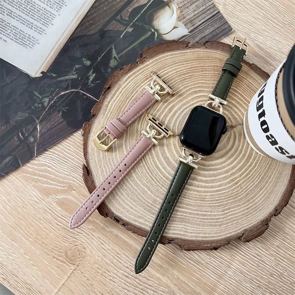 Pink and forest green slim leather Apple Watch bands laid flat
