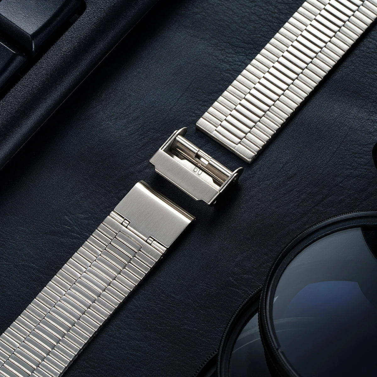 Samsung Galaxy Stainless Steel Link Watch Band - Watch8/Watch8 Classic/Watch9 Business close-up on leather background