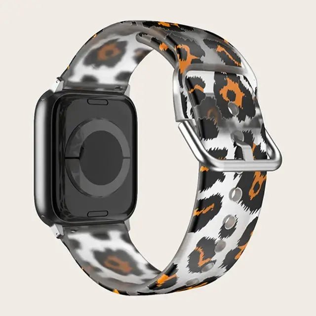 Leopard Print Apple Watch band with buckle and adjustment holes.