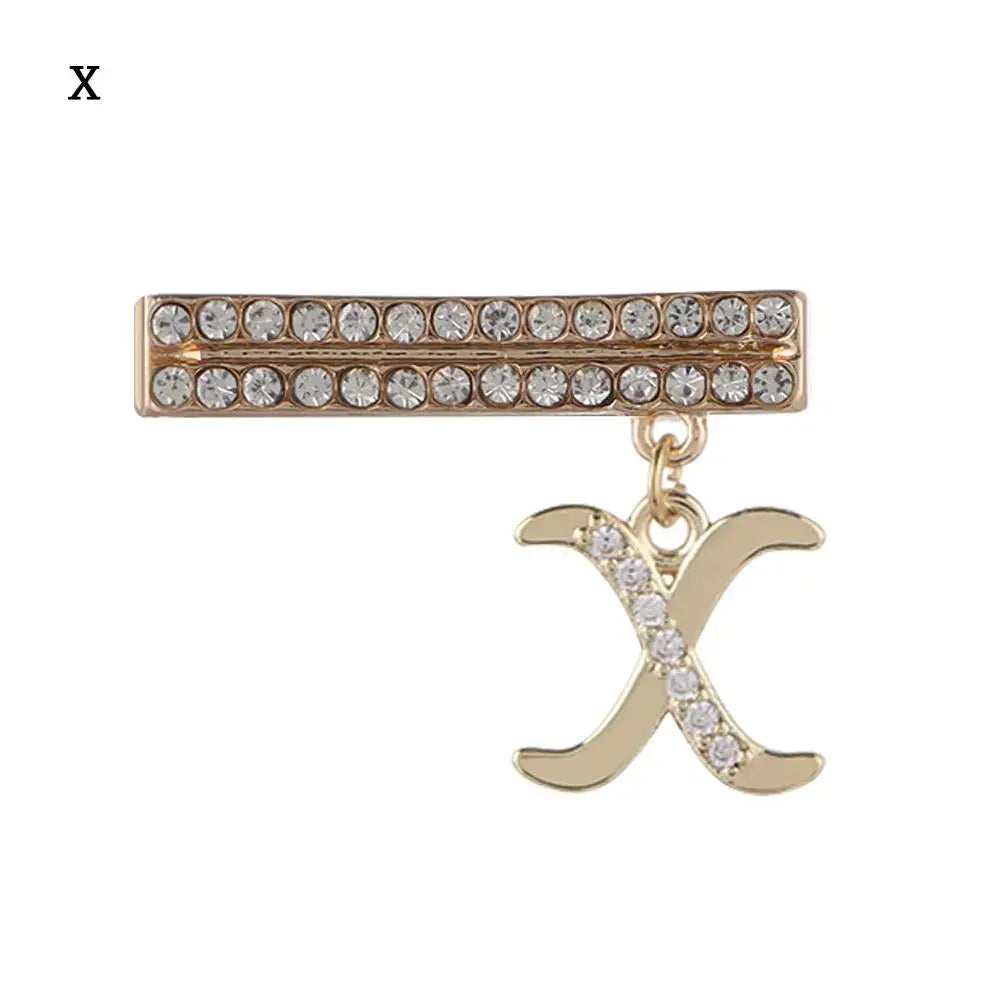 Decorative letter charm with crystal accents for Apple Watch band, featuring a stylish 'X' design.