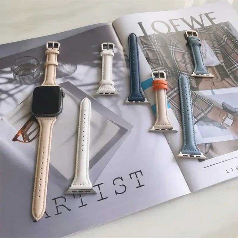Neutral and blue tapered leather Apple Watch straps displayed together