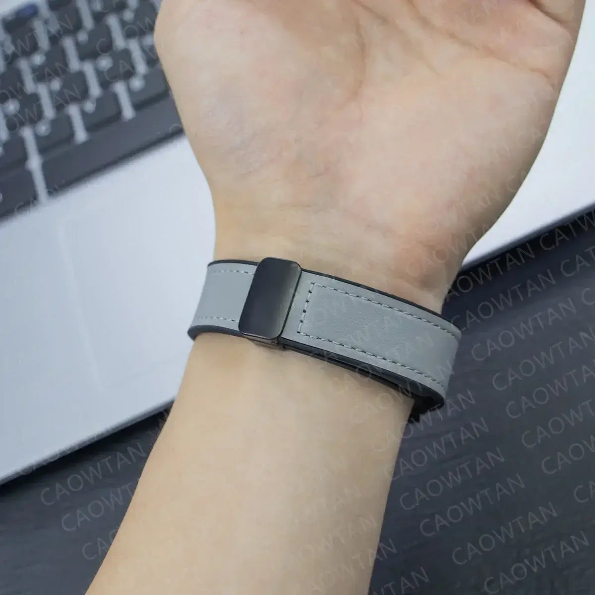 Garmin QuickFit Magnetic Leather Band gray strap shown on a wrist