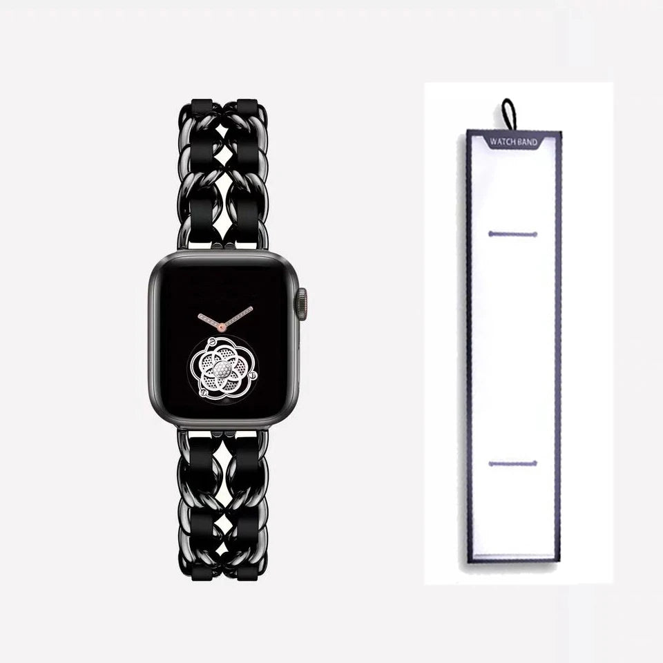 Black chain bracelet with black accents, shown beside packaging for Apple Watch