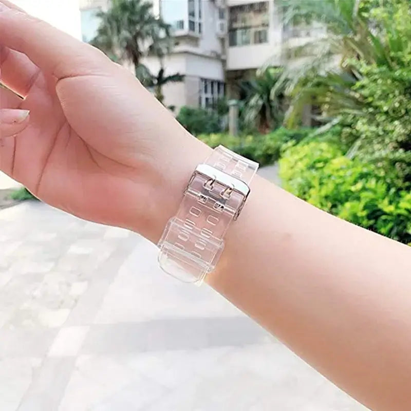Buckle and strap underside of clear Apple Watch band worn on wrist