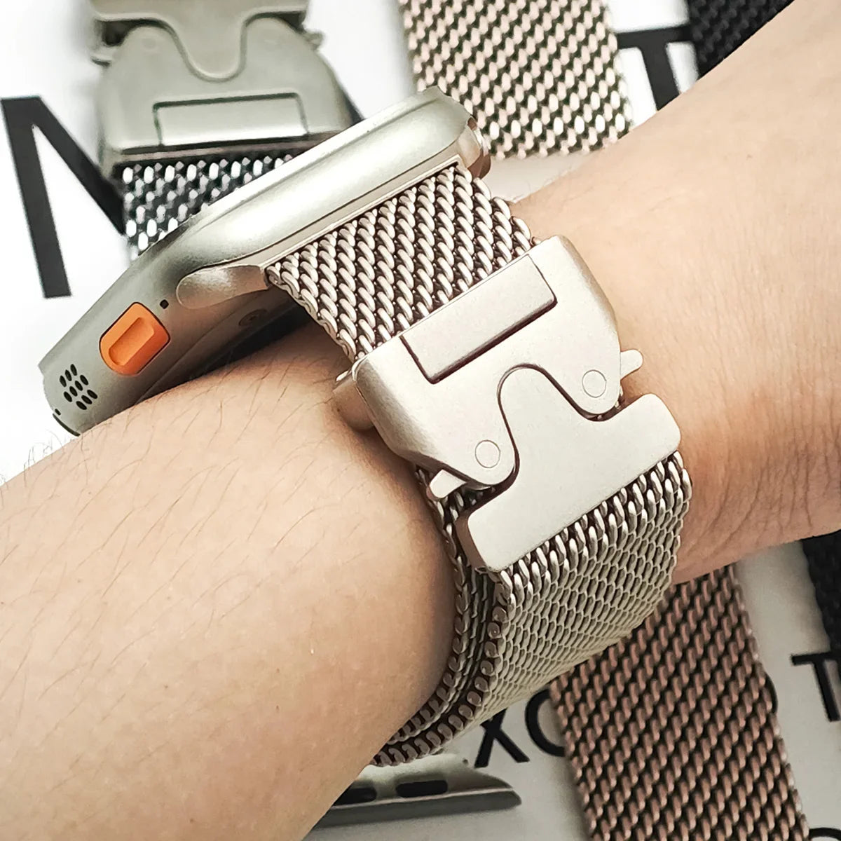 Parachute-style clasp shown on wrist for Apple Watch