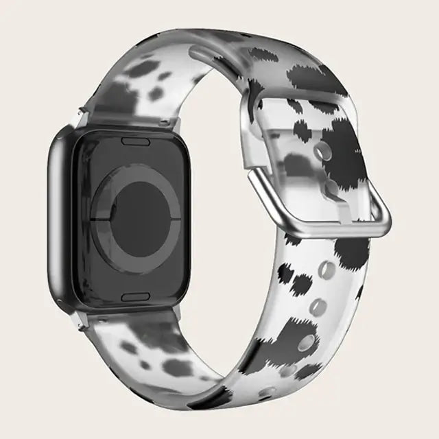 Black / White Leopard Apple Watch band with buckle and adjustment holes.