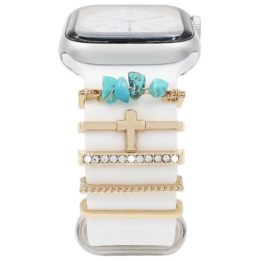 Stylish decorative metal charms on an Apple Watch band, adding elegance and personality to enhance any outfit.