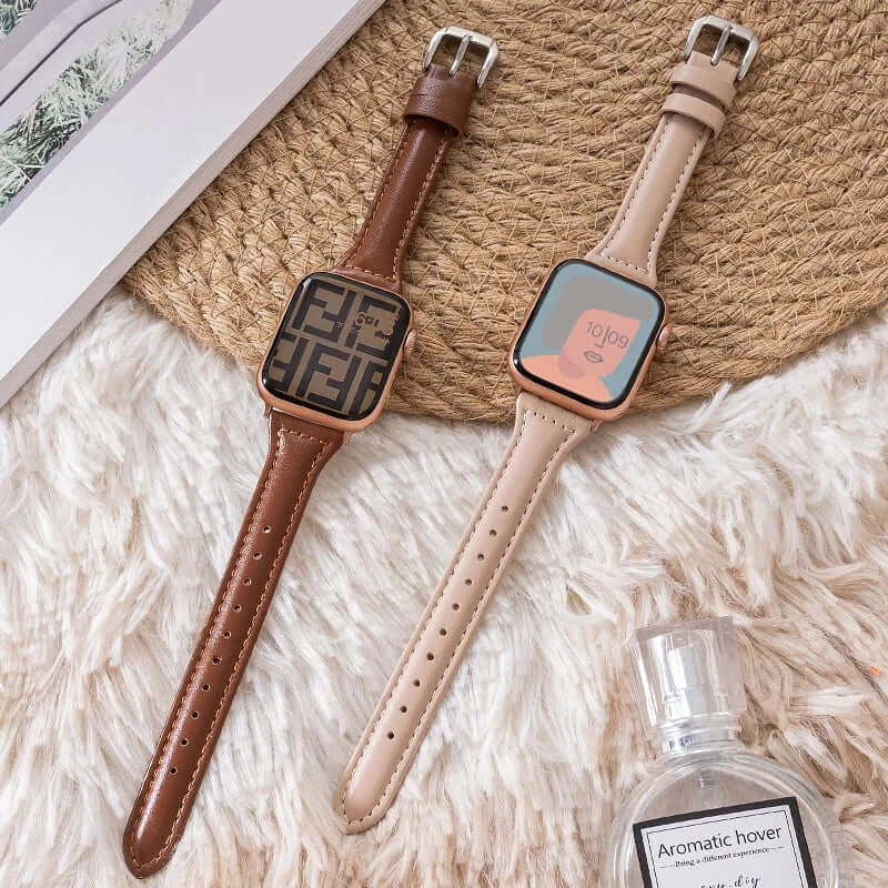 Cognac and beige tapered leather Apple Watch bands laid flat