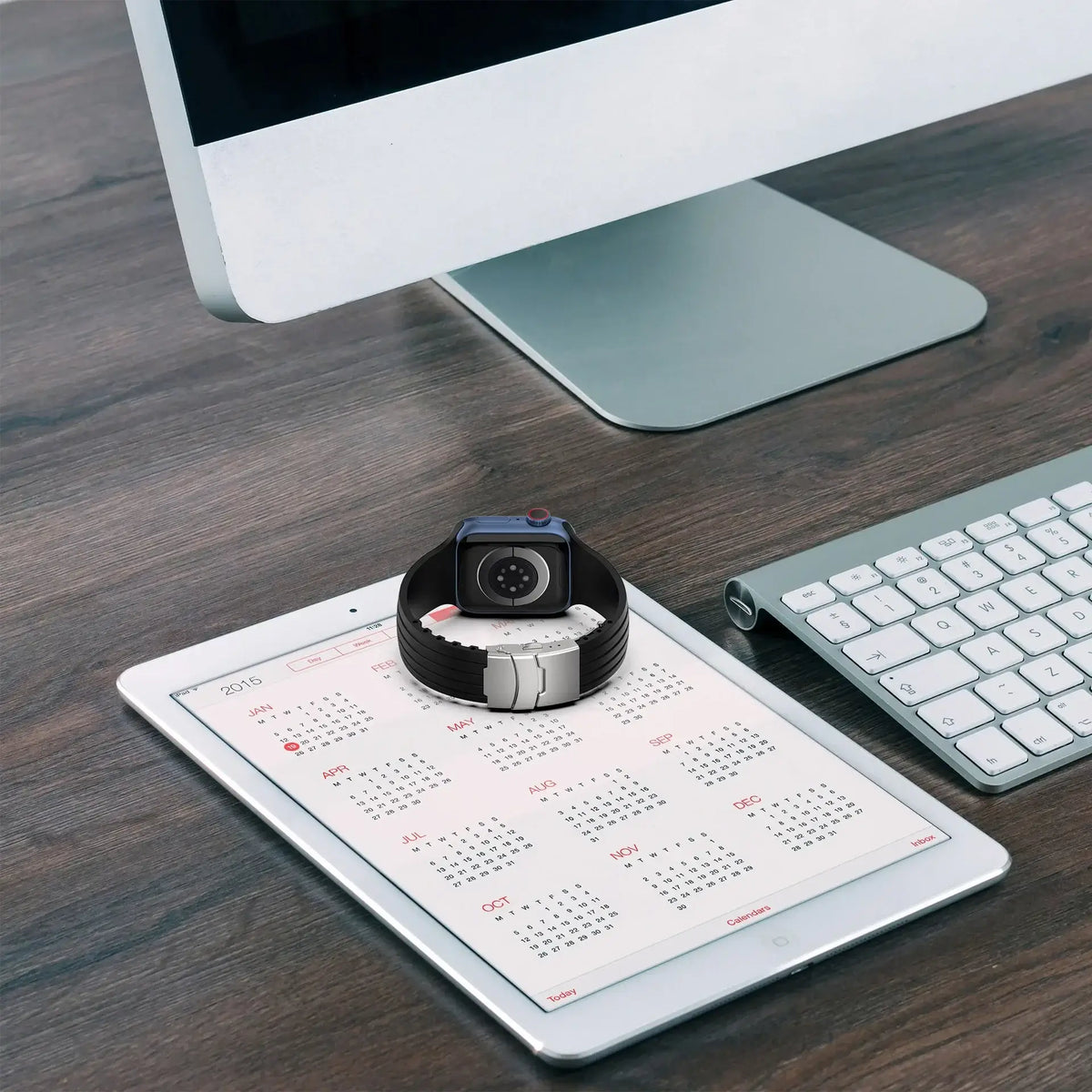 Grooved silicone Apple Watch band displayed beside a desk calendar