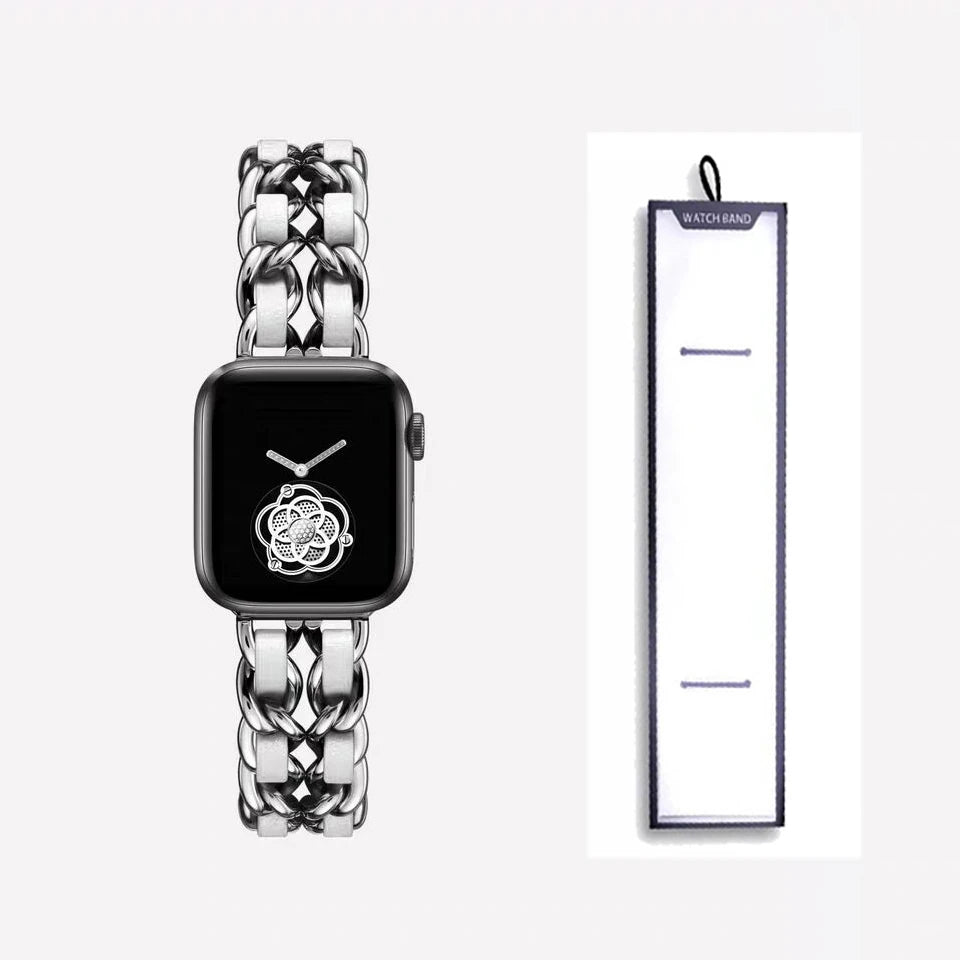 Silver chain bracelet with white accents, shown beside packaging for Apple Watch