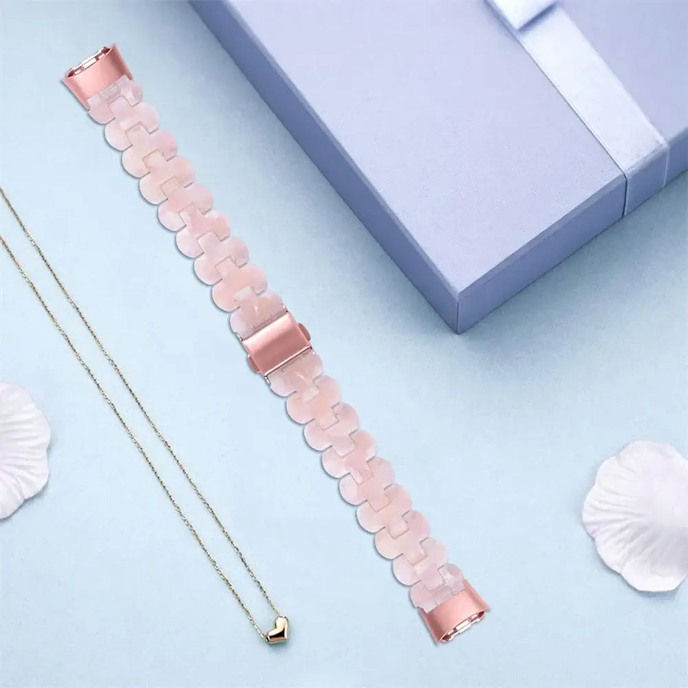 Fitbit Luxe Marbled & Tortoiseshell Resin Band - Pale pink resin strap laid flat