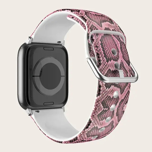 Pink Snakeskin Apple Watch band with buckle and adjustment holes.